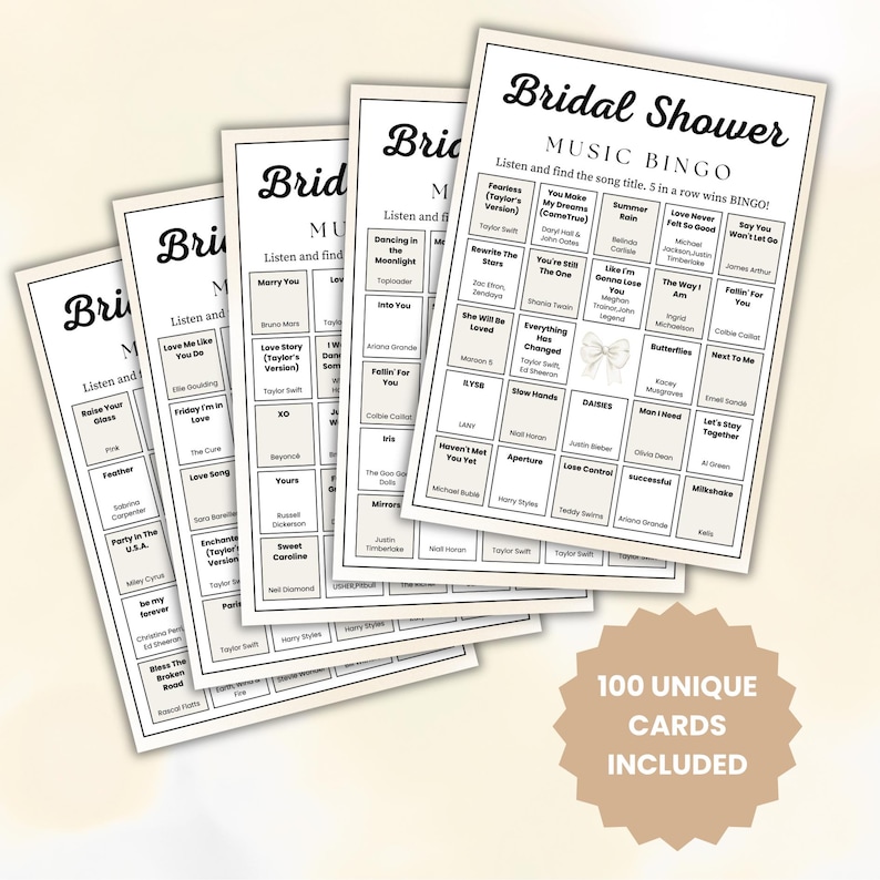May include: A stack of Bridal Shower Music Bingo cards. Each card features a grid of song titles. The cards are white with black text, including the words "Bridal Shower" and "Music Bingo." A tan-colored tag at the bottom reads "100 UNIQUE CARDS INCLUDED."