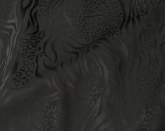 May include: Black fabric with a repeating pattern of animal prints, including zebra stripes and leopard spots. The fabric has a subtle sheen, and the design is embossed, creating a textured effect. The overall look is dark and luxurious.