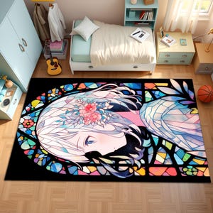 May include: A rectangular area rug featuring a colorful anime-style illustration. The design showcases a woman's face with white hair, adorned with pink flowers, set against a stained-glass window effect with vibrant colors. The rug is on a wooden floor.