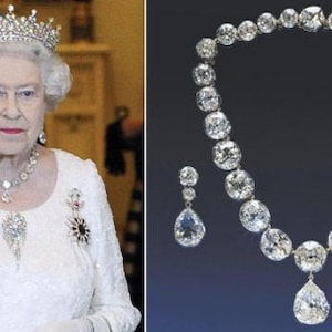 May include: A diamond necklace and earrings set with a large teardrop pendant. The necklace is made of white gold and features a row of round diamonds. The earrings are also made of white gold and feature a single teardrop diamond.