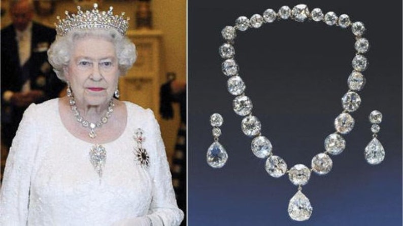 May include: A diamond necklace and earrings set with a large teardrop pendant. The necklace is made of white gold and features a row of round diamonds. The earrings are also made of white gold and feature a single teardrop diamond.