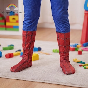 May include: A pair of blue pants with a textured pattern and red boot covers featuring a black spiderweb print. The boot covers extend from the mid-calf down to the feet, mimicking the appearance of a superhero costume with a cohesive design.