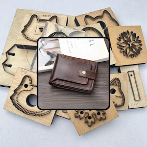 May include: A brown leather wallet with a snap closure and zipper. The wallet is surrounded by various wooden die-cut shapes, including animal and snowflake designs. The wallet appears to be approximately 4.5 inches wide and 3.5 inches tall.