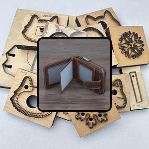 May include: A brown leather wallet with a zipper closure and multiple card slots is displayed open. Surrounding the wallet are various wooden die-cut shapes, including animal faces and geometric designs, used for crafting or leatherwork.