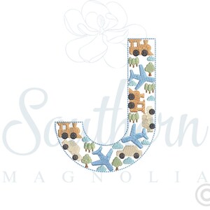 May include: Blue embroidered letter J with a pattern of aeroplanes, trains, and cars. The letter is outlined in blue and has a white background.
