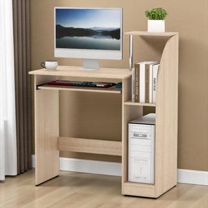 May include: A light wood-effect computer desk with a built-in shelf and a separate tower compartment. The desk has a pull-out keyboard tray, a monitor, and a small white coffee cup. A small potted plant sits on the top shelf.