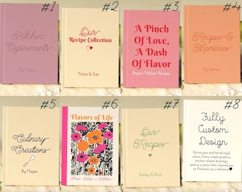 May include: A collection of eight recipe books with various titles and designs. The books are in different colors, including pink, peach, and cream. Some books feature floral illustrations, while others have simple text. The books are designed for kitchen use.
