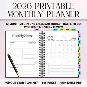 May include: A 2026 printable monthly planner with a black spiral binding. The planner includes sections for monthly reviews, calendars, and goal setting. The text on the cover reads "2026 Printable Monthly Planner". A black pen rests on the open pages.