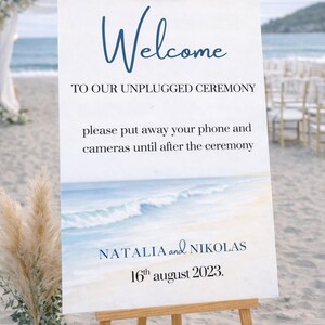 Ocean wedding signs bundle featuring a coordinated set of 13 printable ceremony and reception signs, including welcome sign, seating chart, timeline, bar signs, guest book, cards and gifts, favors, reserved, unplugged ceremony, and table numbers. Soft blue ocean background with elegant coastal typography creates a romantic beach and destination wedding look. Fully editable in Canva and available in multiple sizes, perfect for seaside, coastal, and tropical weddings.