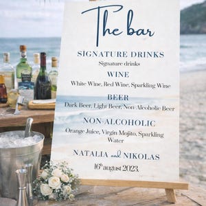 Ocean wedding signs bundle featuring a coordinated set of 13 printable ceremony and reception signs, including welcome sign, seating chart, timeline, bar signs, guest book, cards and gifts, favors, reserved, unplugged ceremony, and table numbers. Soft blue ocean background with elegant coastal typography creates a romantic beach and destination wedding look. Fully editable in Canva and available in multiple sizes, perfect for seaside, coastal, and tropical weddings.
