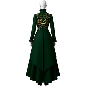 May include: A dark green long coat with a pumpkin design embroidered on the back. The coat has long sleeves, a high collar, and a flared skirt. The pumpkin is gold with a smiling face.