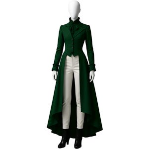 May include: A dark green long coat with a high collar and a long, flowing skirt. The coat is buttoned up the front and is paired with white pants and black boots. The mannequin is on a white background.