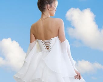 Flowy short White corset wedding dress with delicate wing sleeves. Charming White bridal gown with a fluffy skirt