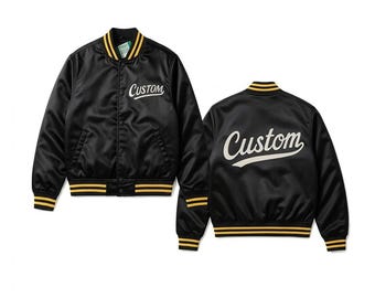 May include: Black satin bomber jacket with yellow and white accents. The jacket features the word "Custom" in a script font on the front and back. The collar, cuffs, and hem have yellow and black stripes.