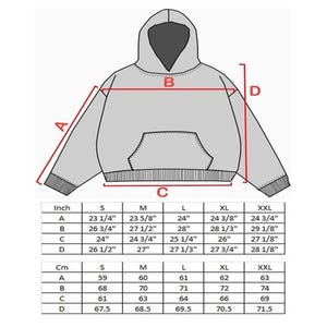 May include: A diagram of a gray hoodie with measurements in inches and centimeters. The diagram shows the dimensions of the hoodie, including the length of the sleeves, the width of the body, and the length of the body. Sizes range from S to XXL.
