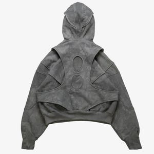 Grey mineral wash tactical hoodie

Hoodie with integrated vest overlay

Multi panel structured streetwear hoodie

Avant-garde layered pullover hoodie

High neck tactical streetwear hoodie

Futuristic cutout panel hoodie

Heavyweight boxy cropped hoodie

Custom script font tactical hoodie

Back panel cutout detail hoodie