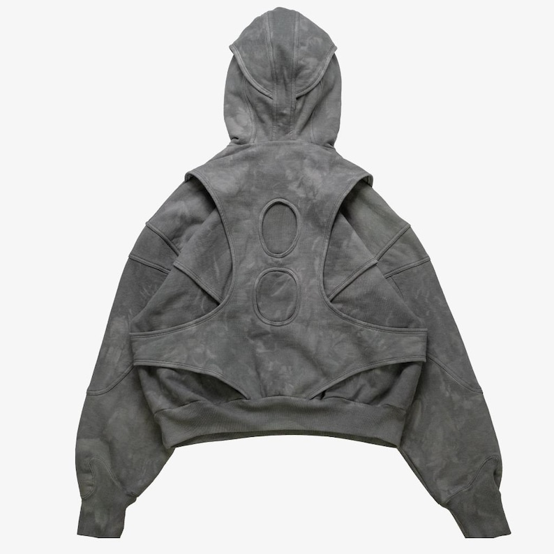 Grey mineral wash tactical hoodie

Hoodie with integrated vest overlay

Multi panel structured streetwear hoodie

Avant-garde layered pullover hoodie

High neck tactical streetwear hoodie

Futuristic cutout panel hoodie

Heavyweight boxy cropped hoodie

Custom script font tactical hoodie

Back panel cutout detail hoodie