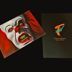 May include: A close-up of a scary clown face with red hair and a menacing expression. The image is part of a 31 Days of Halloween series, Series 1 (2013).