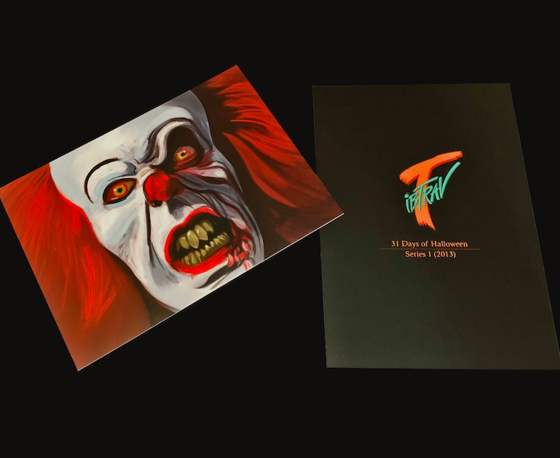 May include: A close-up of a scary clown face with red hair and a menacing expression. The image is part of a 31 Days of Halloween series, Series 1 (2013).