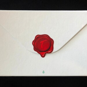 May include: A white envelope with a red wax seal. The seal has the number "7" embossed in it.