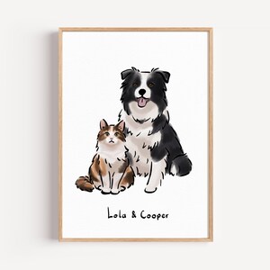 Op de afbeelding: Een ingelijste kunstdruk met een Border Collie en een kat, beide geïllustreerd in een aquarel stijl. De hond is zwart en wit, en de kat is bruin en wit. De namen "Lola & Cooper" staan eronder geschreven.