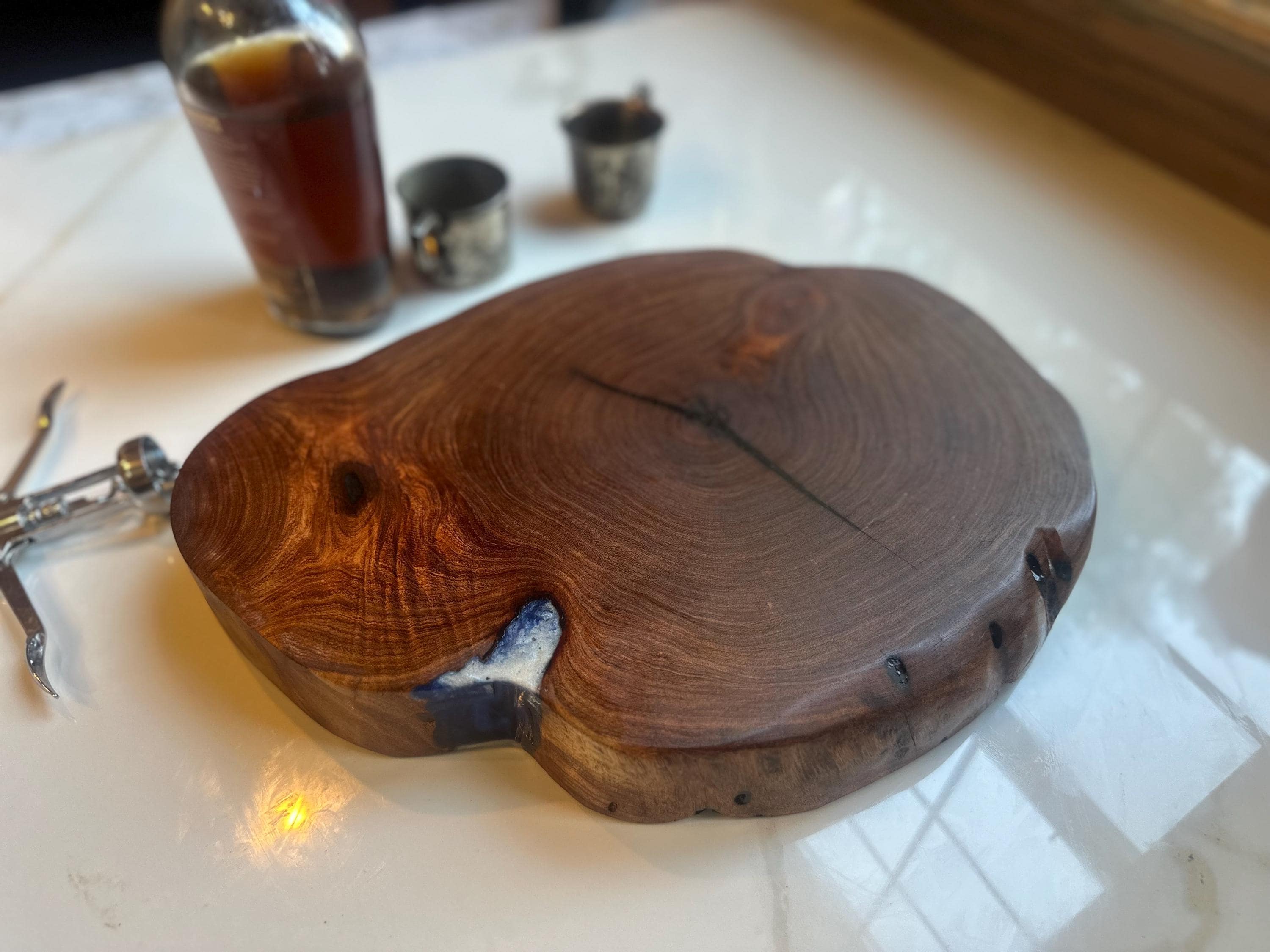 Mesquite end grain cutting board or centerpiece with light blue resin fill