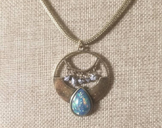 Iridescent tealblue opal teardrop on antique brass pendant on 20 olive cotton waxed cord