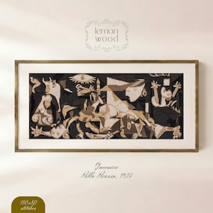 May include: Framed cross-stitch of Picasso's Guernica, 1937, in black, white, and tan. The artwork is in a gold-toned frame, with the text "Guernica, Pablo Picasso, 1937" below the image. The Lemon Wood logo is at the top.