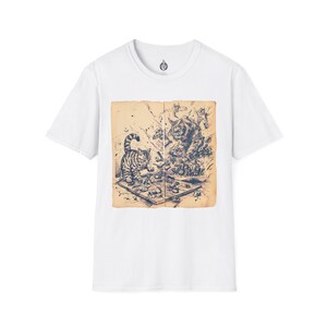 May include: White t-shirt featuring a detailed black and white illustration of two cats engaged in a chess game. The artwork is set against a vintage-style background, adding a classic touch to the design. The shirt has a crew neck and short sleeves.