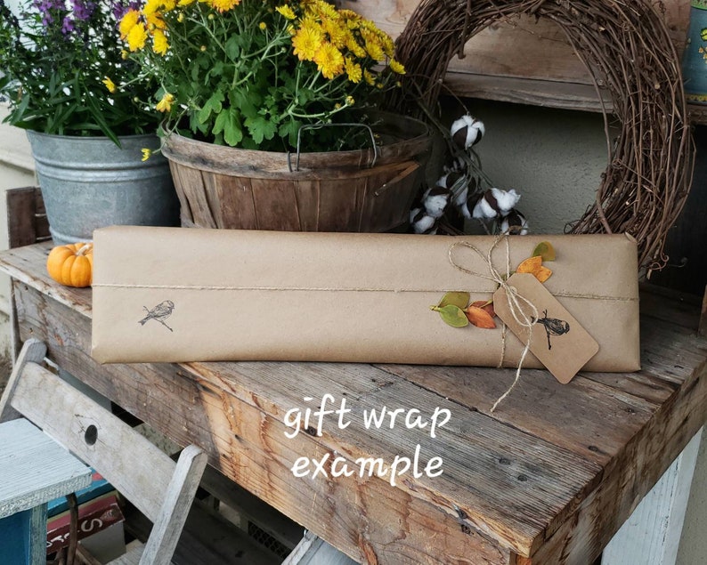 May include: A set of three ceramic mugs with a speckled, matte finish. The mugs are in shades of gray, white, and black. Each mug has a simple, modern design and a rounded handle. The mugs are stacked on top of each other.