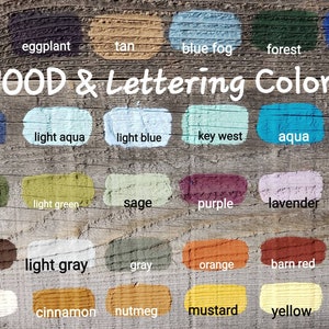 May include: Image showcasing a variety of wood and lettering colors. The image displays color swatches in shades like black, navy, olive, brown, white, and more. The text "WOOD & Lettering Colors" is displayed in white lettering.