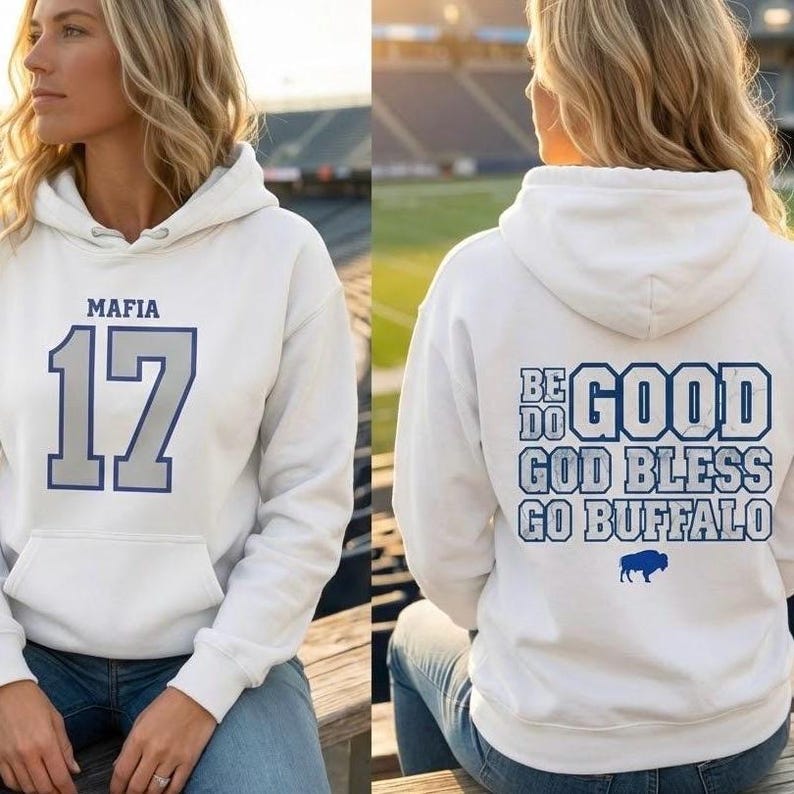 Puede incluir: Sudadera con capucha blanca con bolsillo delantero. La parte delantera presenta "MAFIA" sobre el n&uacute;mero "17" en azul. La parte trasera muestra "BE DO GOOD GOD BLESS GO BUFFALO" con un logotipo de b&uacute;falo azul.