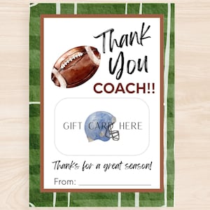 May include: A football-themed gift card holder with a watercolor football and helmet illustration. The text reads "Thank You COACH!!" and "Gift Card Here." The background has a green field design with white yard lines.