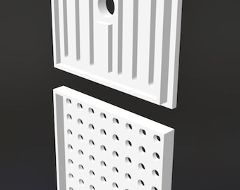 May include: Two white, rectangular panels. The top panel has vertical grooves and a circular hole. The bottom panel is perforated with numerous small, evenly spaced holes. Both panels are set against a dark background.