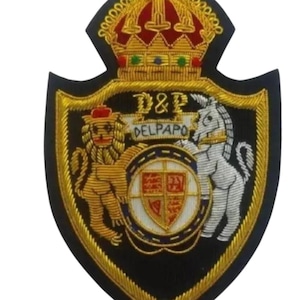 May include: Embroidered patch with a black background, gold trim, and a shield design. Features a gold lion, a white horse, a red and gold crown, and the text "D&P DELPAPO".