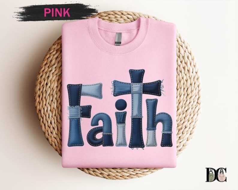 A pink t-shirt with the word "Faith" written in a stylized font made up of blue denim pieces.
