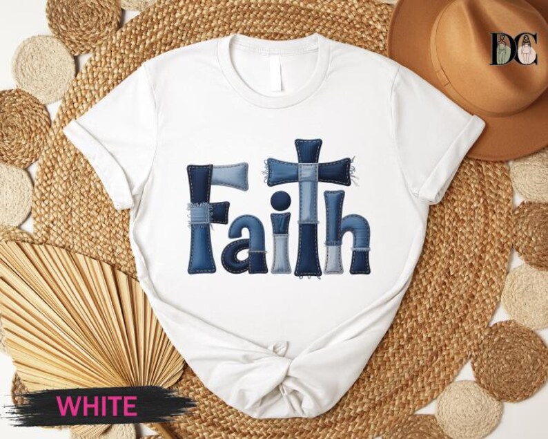 A white t-shirt with the word "Faith" printed in blue letters, surrounded by various items such as a hat, straw hat, and a fan.