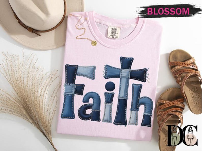 a pink t-shirt with the word "Faith" written in blue denim patches, a beige hat, a pair of brown sandals, and some dried flowers.