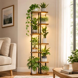 May include: A tall, narrow plant stand featuring a dark metal frame and multiple wooden shelves. Each shelf is illuminated by integrated LED lighting and holds a variety of potted green plants, including a trailing vine and leafy foliage.