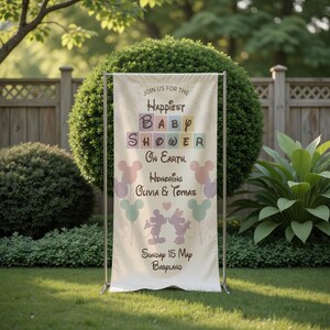 May include: A cream-colored baby shower banner with the text "Join us for the Happiest Baby Shower on Earth." The banner features Mickey and Minnie Mouse illustrations, pastel balloons, and the names Olivia & Tomas. The date is Sunday, May 15th.