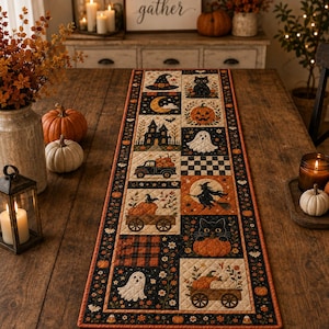 May include: A rectangular quilted table runner featuring a patchwork design with Halloween motifs including black cats, ghosts, pumpkins, a witch on a broomstick, a haunted house, and a truck. The border is black with orange pumpkins and white bats.