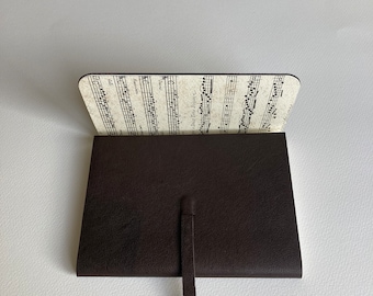 Leather Sketchbook Journal Leather. Dark Brown Leather with an Antique Finish. Lined with a printed paper of an old Music Score.