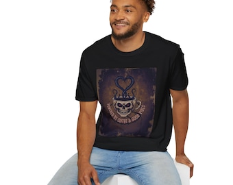 May include: Black t-shirt featuring a skull-shaped coffee cup design with steam forming a heart shape. The text "POWERED BY COFFEE & GOOD VIBES" is printed around the cup. The shirt is worn by a person.