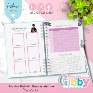 May include: A spiral-bound planner with a light blue cover and pink interior pages. The planner includes sections for scheduling, notes, and a calendar. Text on the cover reads "Archivo Digital - Planner Merlina, Tama&ntilde;o A5". The planner is decorated with floral accents and the text "Gibby".