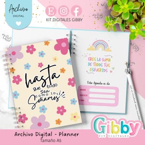 Puede incluir: Un planificador A5 con espiral y diseño floral. La portada tiene el texto "Hasta que todo sea como lo soñamos". La página abierta muestra un arcoíris y el texto "Eres la suma de todos tus esfuerzos".