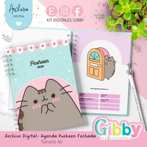 May include: A spiral-bound planner with a light blue cover featuring a Pusheen cat design and the year 2026. The planner includes a pink and white interior with a door illustration and contact information. The text "Archivo Digital- Agenda Pusheen Fechada Tamaño A5" is visible.