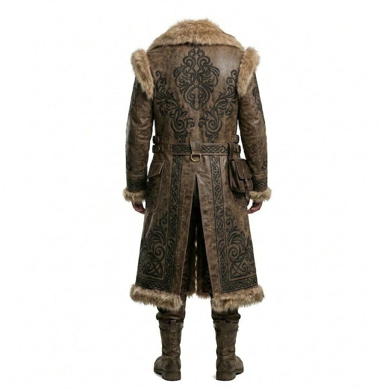 May include: A long brown coat featuring dark black intricate scrollwork embroidery, a thick faux fur collar, and matching faux fur trim on the cuffs and hem. The coat includes a waist belt with a buckle, side pockets, and a small attached pouch.