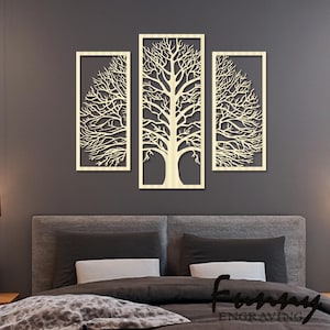May include: A three-part wall art set depicting a tree. The artwork is crafted from light-coloured wood, with detailed cut-out branches and a trunk. The rectangular pieces are arranged to form a complete image. The background is a dark grey.