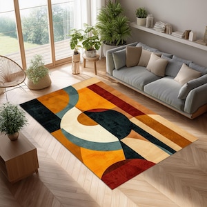 Può includere: Un tappeto rettangolare con un design geometrico. Il tappeto presenta una combinazione di colori tra cui arancione, nero, crema e verde acqua. Il design include linee curve e rette, creando un motivo astratto. Il tappeto è posizionato su un pavimento in legno.
