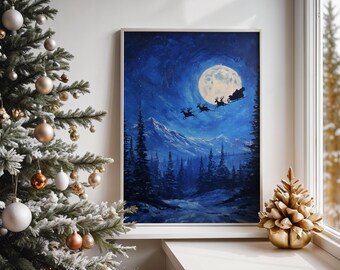 May include: A framed painting depicts a winter night scene with a full moon and a silhouette of Santa's sleigh pulled by reindeer. The artwork is set against a backdrop of snow-covered mountains and evergreen trees. A gold-colored decorative tree sits on the windowsill.